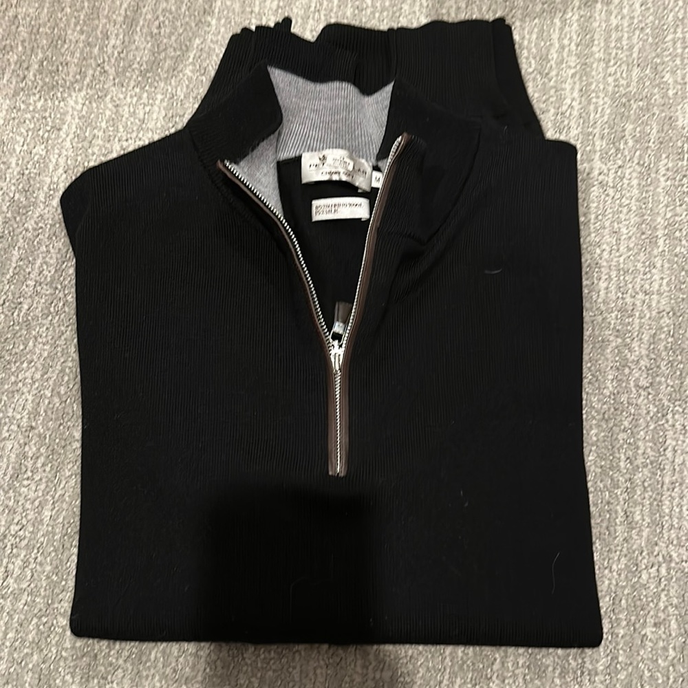 Peter Millar men’s black and brown leather half zip sweater.